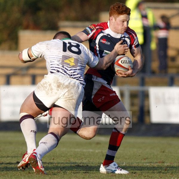 Connor Braid tries to avoid a tackle by James Currie. Doncaster Knights v Leeds Carnegie at Castle Park, Doncaster on 16th January 2013, KO 1430. RFU Championship - Stage 1.