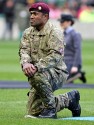 A serviceman of the British Armed Forces taking part in the parade of the National flags. Barbarians v Fiji at Twickenham Stadium, Twickenham, London, England on 30th November 2013 ko 1430