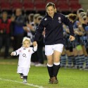 Emma Croker and daughter run out first to mark Wmma's 50th Cap. England Women v Wales Women at Twickenham Stoop, Twickenham, England on 7th March 2014 ko 1930