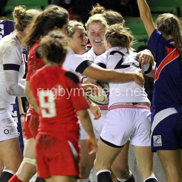 Rachael Burford and Vicky Fleetwood congratulate Natasha Brennan on scoring her first try on her first cap with her first touch of the ball. England Women v Wales Women at Twickenham Stoop, Twickenham, England on 7th March 2014 ko 1930