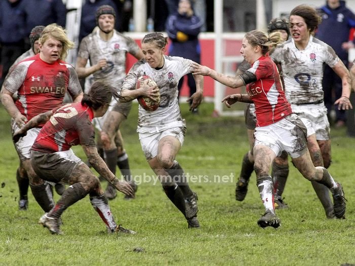 Katy McLean leads from the front as she makes a break through the Welsh defence
