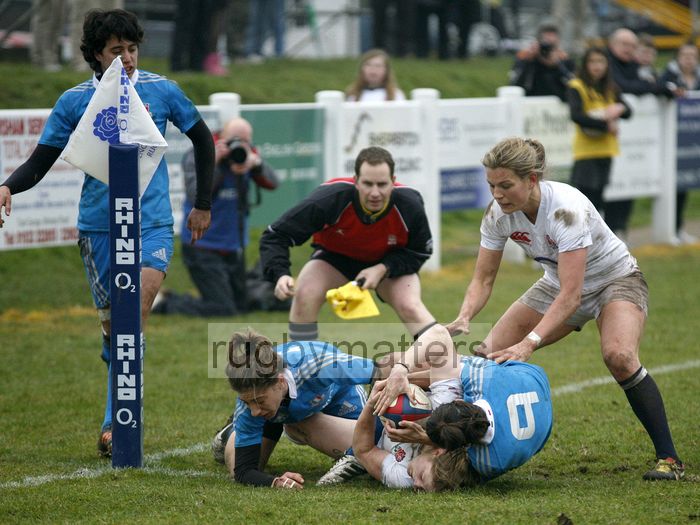 Lydia Thompson is held up on the line by Sofia Stefan and Sara Barattin, Abi Chamberlain gives support. England Women v Italy Women at Esher RFC, Moseley Road, Hersham, Surrey on 9th March 2013, KO 1300.