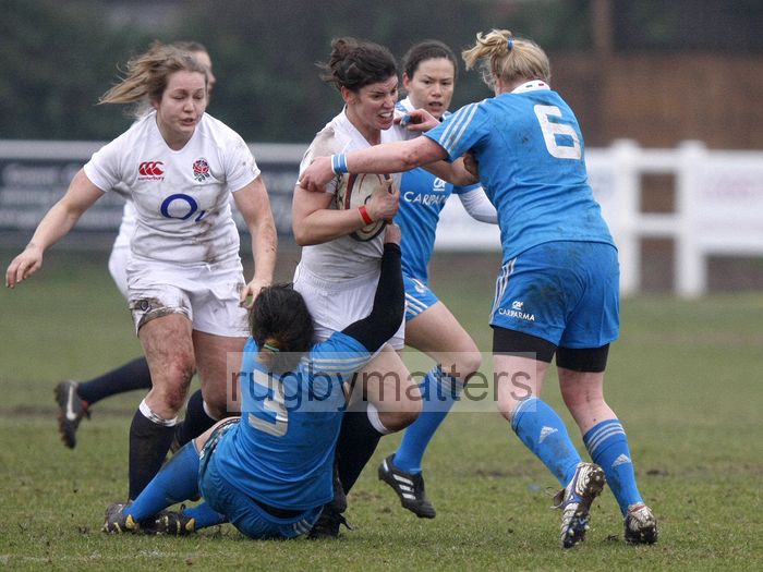 Sarah Hunter tackled by Lucia Gai and Michela Este. England Women v Italy Women at Esher RFC, Moseley Road, Hersham, Surrey on 9th March 2013, KO 1300.