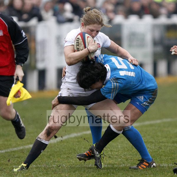 Lydia Thompson tackled by Manuela Furlon who tries to take her into touch. England Women v Italy Women at Esher RFC, Moseley Road, Hersham, Surrey on 9th March 2013, KO 1300.