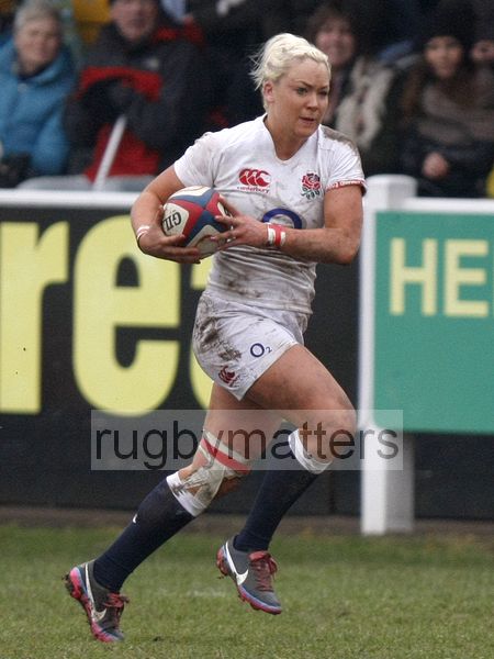 Sally Tuson makes a break on the wing which leads to her scoring a try. England Women v Italy Women at Esher RFC, Moseley Road, Hersham, Surrey on 9th March 2013, KO 1300.