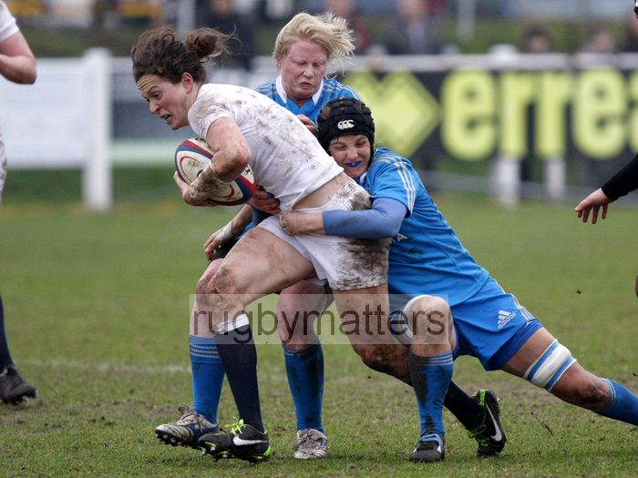 Jo McGilchrist tackled by Alice Trevisan. England Women v Italy Women at Esher RFC, Moseley Road, Hersham, Surrey on 9th March 2013, KO 1300.