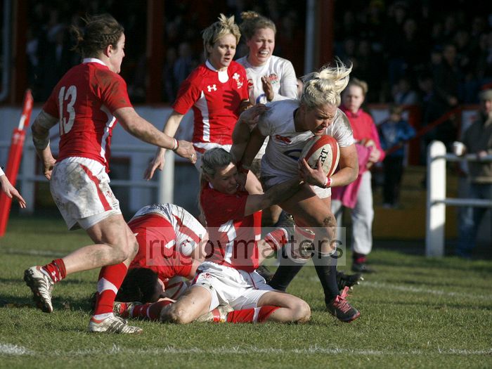 Sally Tuson barges through a tackle from Caryl James and goes on to score a try. Wales Women v England Women at Talbot Athletic Ground, Manor Street, Port Talbot, West Glamorgan, Wales on 17th March 2013 KO 1430