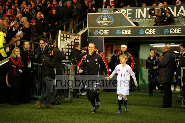Captain Katy McLean leads the team out with mascot. England v New Zealand in Autumn International Series at Twickenham, England on 1st December 2012.