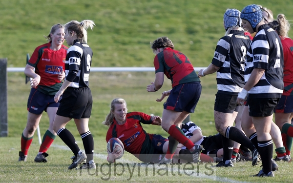 Rose Jay smiles as she scores a try.