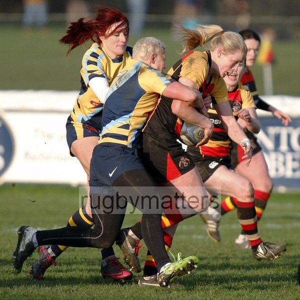 Alex Matthews tackled by Heather Fisher and Jo Watmore. Richmond v Worcester, 13th January 2013, The Athletic Ground, Twickenham Road, London.