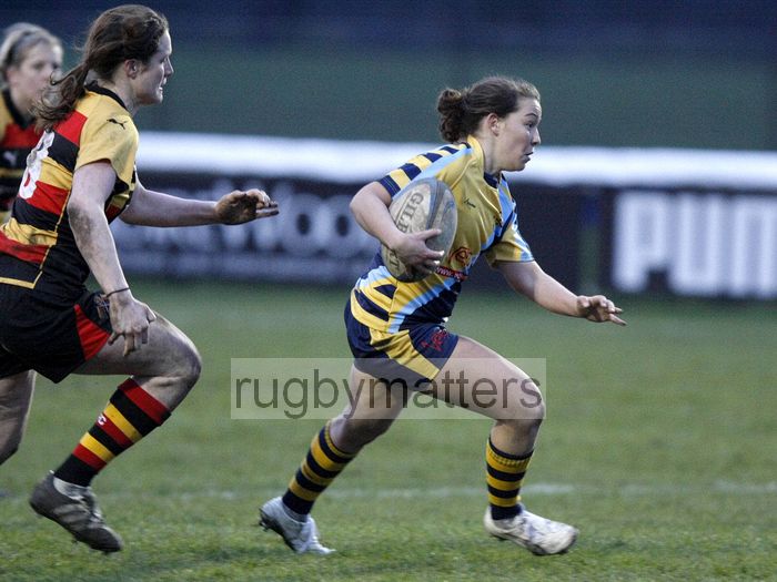 Charlotte Keane makes a break pursued by Becky Essex. Richmond v Worcester, 13th January 2013, The Athletic Ground, Twickenham Road, London.