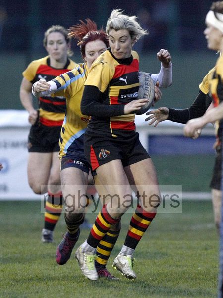Alice Richardson with Jo Watmore approaching to tackle. Richmond v Worcester, 13th January 2013, The Athletic Ground, Twickenham Road, London.