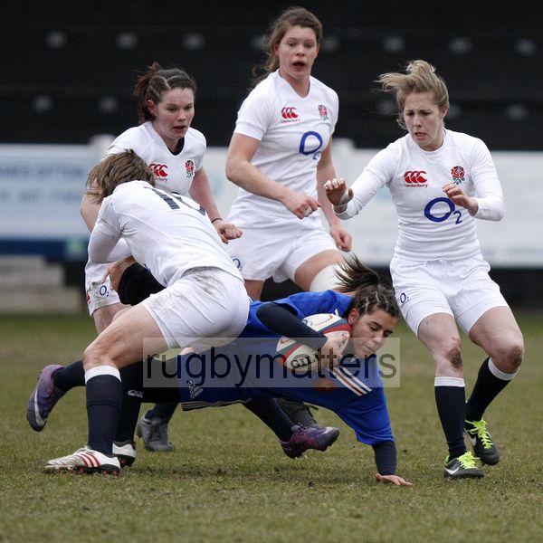 Marion Garnier tackled by Meg Goddar. U20 England Women v U20 France Women at Esher RFC, Molesey Road, Hersham, Surrey. 23rd February 2013, KO 1400.