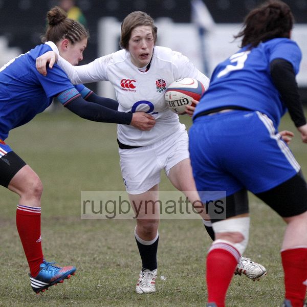 Meg Goddard tackled by Camille Boudaud. U20 England Women v U20 France Women at Esher RFC, Molesey Road, Hersham, Surrey. 23rd February 2013, KO 1400.