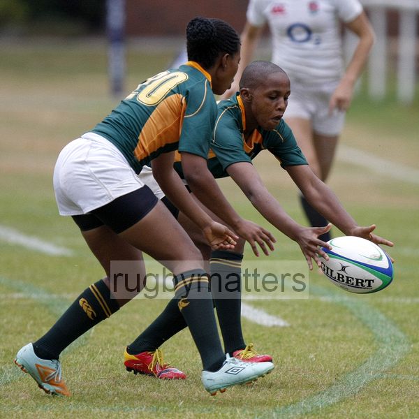Vuyolwethu Maqholo and Nonhlanhla Mtambo try to secure loose ball. . England v South Africa in the U20's Nations Cup 3rd/4th place, Trent College, Derby Road, Long Eaton, Nottingham, 21st July 2013, kick off 1400.