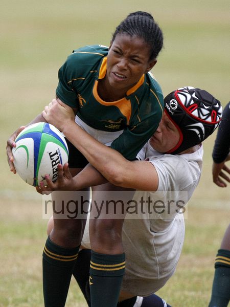 Nonhlanhla Mtambo tackled by Bianca Blackburn. England v South Africa in the U20's Nations Cup 3rd/4th place, Trent College, Derby Road, Long Eaton, Nottingham, 21st July 2013, kick off 1400.