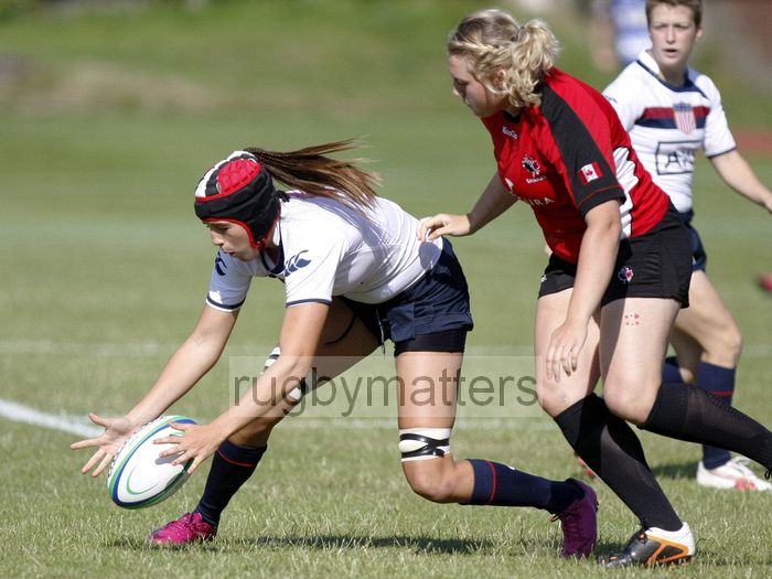 Megan Pinson gathers a loose ball. USA v Canada in the U20's Nations Cup, Trent College, Derby Road, Long Eaton, Nottingham, 11th July 2013, kick off 1700.
