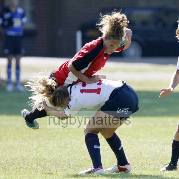 Breanne Nicholas tackled by her opposite number Brianna Troyer. USA v Canada in the U20's Nations Cup, Trent College, Derby Road, Long Eaton, Nottingham, 11th July 2013, kick off 1700.