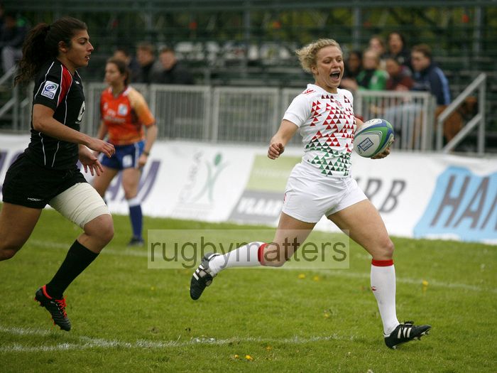 Kay Wilson smiles as she sees the line and goes on to score a try. IRB Women's Sevens World Series at Amsterdam Sevens, National Rugby Centre, Amsterdam, 18th May 2013